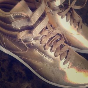 Women’s gold Reebok high top sneakers